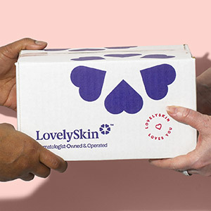 Hands holding LovelySkin shipping box 0t 