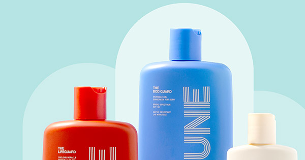 Dune Suncare bottles on platforms in front of illustrated arches